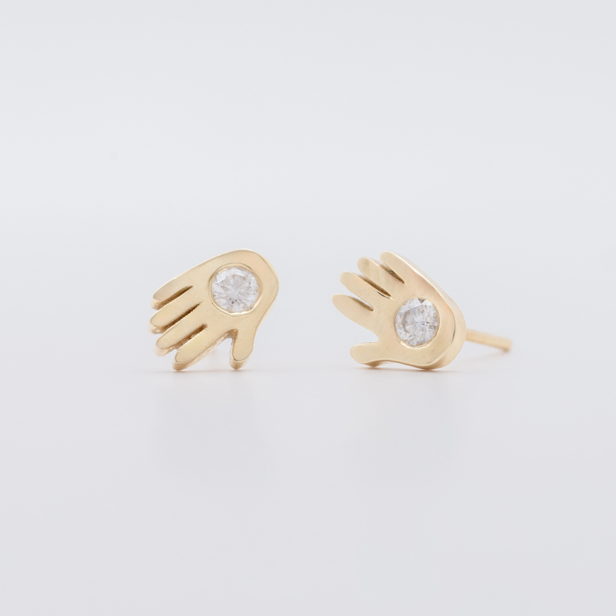 Open hand diamond studs